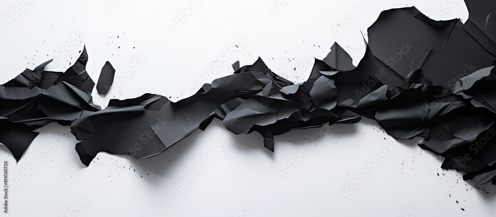 Poster There is a black paper with torn edges placed on a white background creating a space for an advertising copy