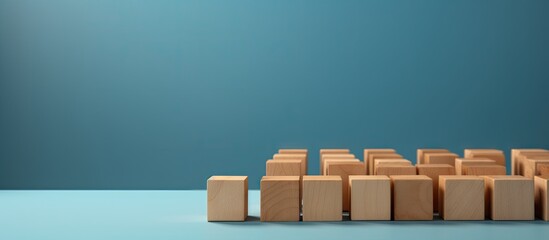 Wooden blocks with a check mark symbol set against a blue background create a checklist concept with ample copy space for additional content