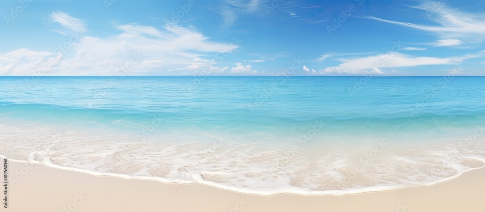 Poster a picturesque scene of a sunny day with white sand a clear blue sea and plenty of space for text or 