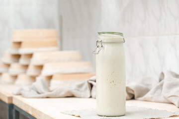 Sourdough for homemade bread in a bottle on the table