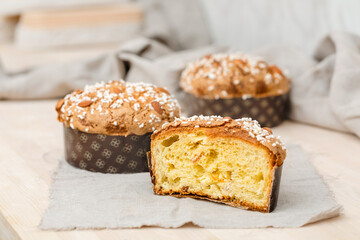 Homemade muffin with nuts and raisins in a cut on the table