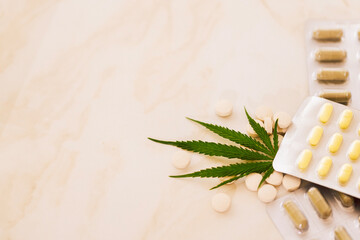 Mockups of medicines on a beige background with cannabis leaf.