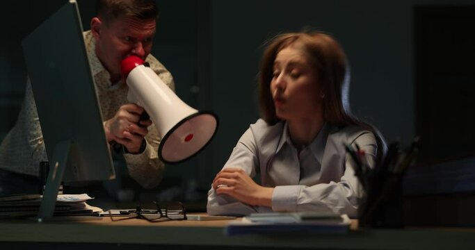 Boss supervising work of ward and shouting into bullhorn while sleeping at work 4k movie. Discipline at work concept