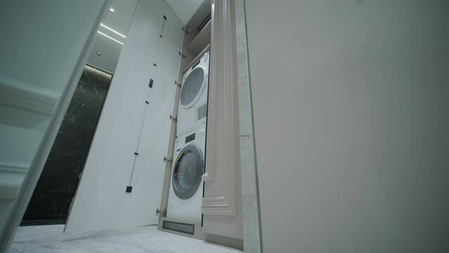 Modern Laundry Room with Stacked Washer and Dryer