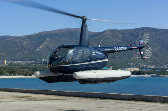 Hydroaviation salon 2010 Single-engine light helicopter. Eurocopter EC130 B4 performs landing approach after demonstration flight over Gelendzhik Bay. Gelendzhik, Russia - September 11, 2010