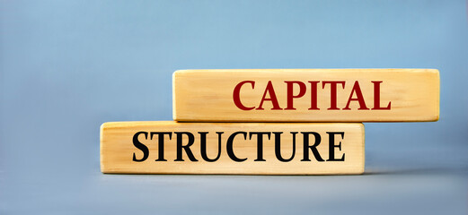 CAPITAL STRUCTURE - words on wooden blocks on blue background