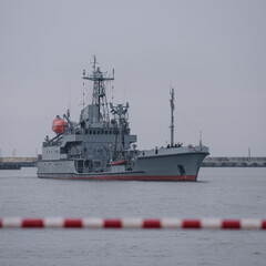WARSHIP - A navy fuel tanker maneuvers in a seaport