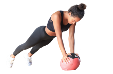 Beautiful young sports African woman is working out with medicine ball on a transparent background