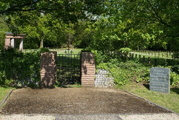 Saint-Desir, France - May 7, 2024: This german war cemetery in Saint-Desir contains the graves of about 3700 soldiers killed during Second World War. Sunny spring day. Selective focus