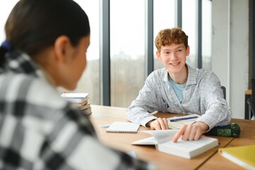 Group of college students doing homework