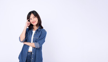 Asian woman wearing denim jean with thinking pose against a white background.