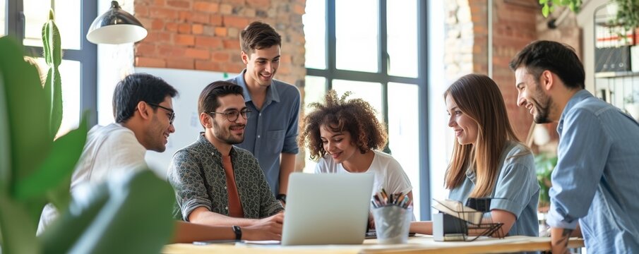 A diverse team of young adults engaging in a meeting with a laptop in a bright, modern office, conveying a dynamic and collaborative work atmosphere. - Powered by Adobe