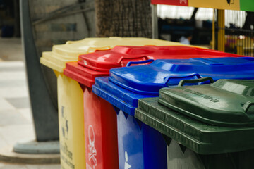 Outdoor public trash can used for garbage disposal and garbage separation for environmental protection and cleanliness concept in vintage tone background.