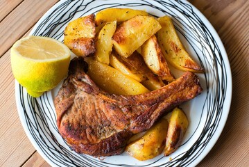 pork steak with potatoes, baked in the oven