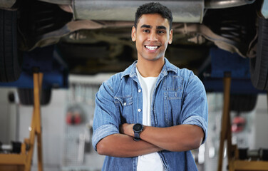 Small business, portrait and mechanic in workshop for startup, car repairs and maintenance. Man,...