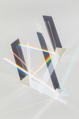 Glass geometric figures prisms with light diffraction of rainbow spectrum colors and complex...