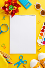 Creative summer program theme. Top vertical  view of art materials: sketchpad, colored pencils,...