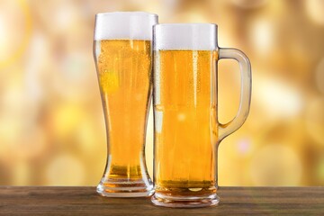 Beer two glasses with white Foam on the desk