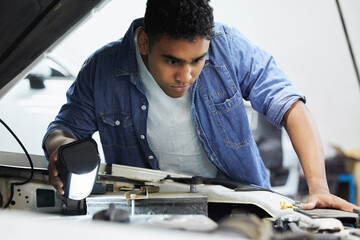 Garage, mechanic or man with car engine for inspection, maintenance and professional repair. Motor...