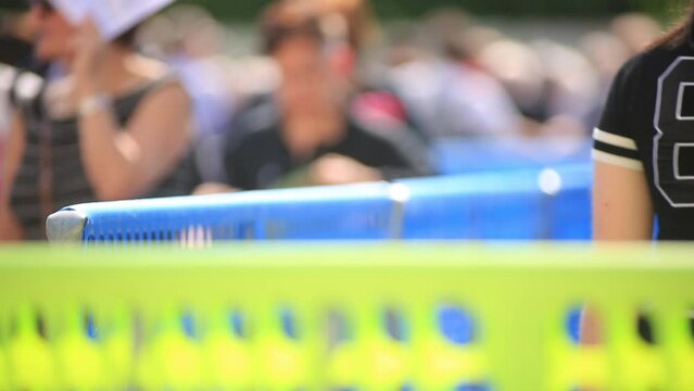 People walking in line at event entrance &ndash; close-up through barrier	