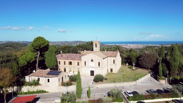 Drone footage of parish church of Saint Stephan on a sunny day in Candelara city, Italy