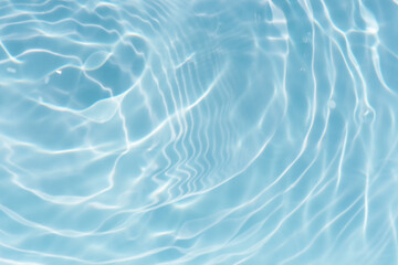 Blue water with ripples on the surface. Defocus blurred transparent blue colored clear calm water...