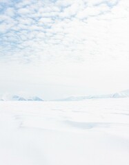 Bright white glacier ice surface. Pale pastel arctic landscape as background. 
