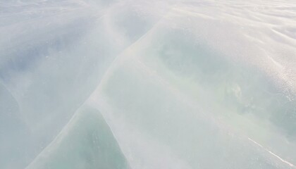 Bright white glacier ice surface as background. 
Pale pastel colours. 