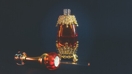 Perfumery. A bottle of oriental perfume with a glass rod for applying oil-based perfume