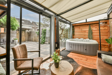 Modern home patio with hot tub and stylish furniture