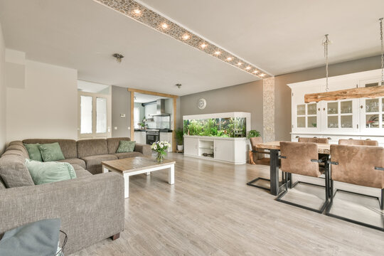 Spacious modern living room with kitchen and dining area