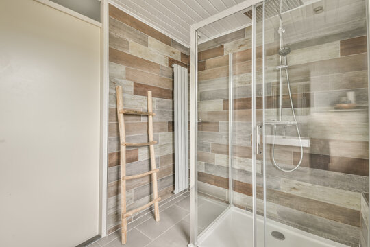 Contemporary wooden tiled bathroom with glass shower