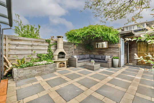 Cozy Backyard Patio with Comfortable Seating and Fireplace