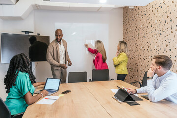 Diverse team brainstorming in a modern coworking space