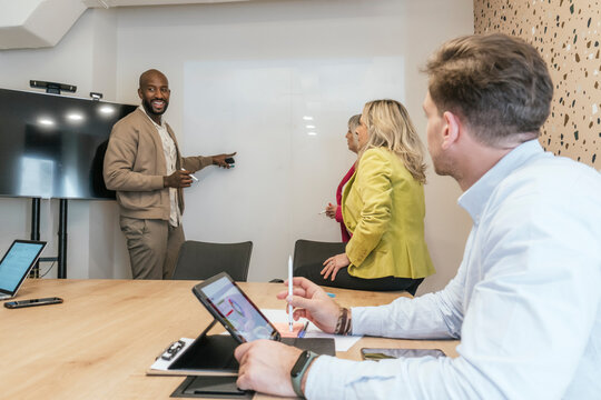 Diverse team engaging in a coworking space meeting