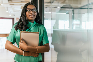 Confident professional woman in modern coworking space
