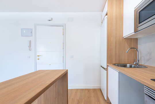 Modern empty kitchen in a light-toned apartment