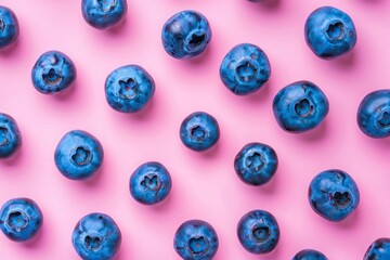 Colorful fruit pattern of blueberries on pink background. Top view. Flat lay