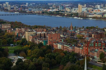 a city by the water and several tall buildings in the distance