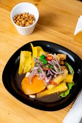 the meal has salads and fruit on it, along with other dishes