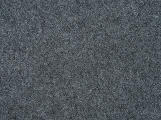 A stony gray felt texture embodies resilience, reminiscent of a rugged landscape softened by the...