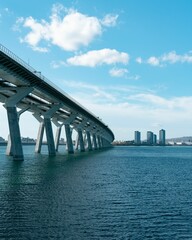 the bridge is over the calm water in the city park