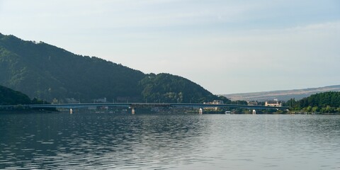 a body of water with a bridge in the distance: Lake Kawaguchi, Yamanashi, Japan