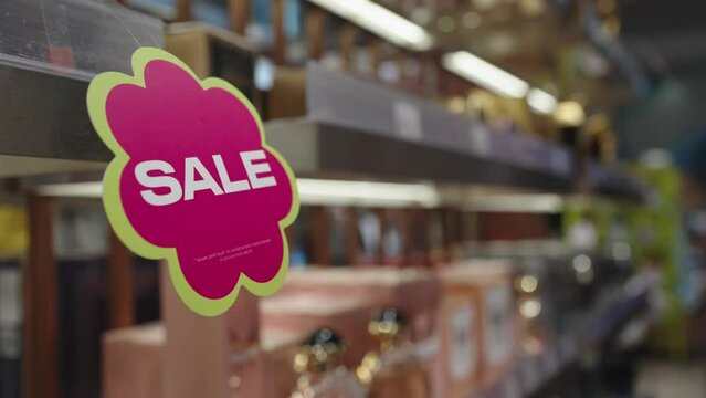 SALE sign background. Sale sign on shelf in supermarket, business concept, selective focus.