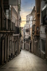 Panoramic view of a medieval town in Spain at sunset with narrow stone houses and streets.