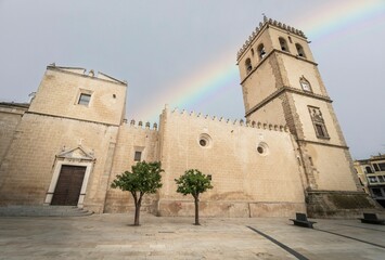 Cathedral of St. John the Baptist or in the medieval capital of Badajoz under a great rainbow.