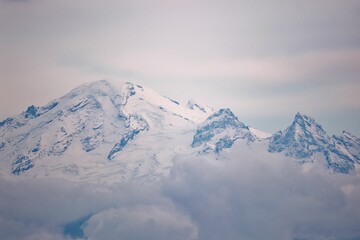 Majestic landscape of snow-covered Mount Baker peaks and cloudy skies