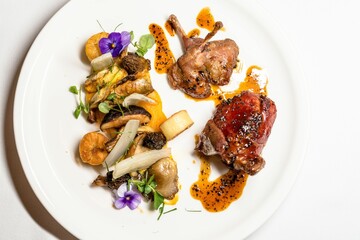 Plate of freshly prepared food, including mushrooms, meat, and assorted vegetables