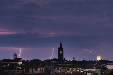 Dramatic weather scene of Verona, Italy with a brilliant display of lightning and thunder