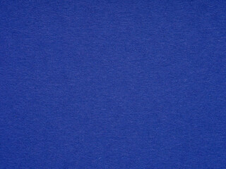 A deep cobalt blue texture suggests a quiet strength and a touch of mystery in its uniform expanse
